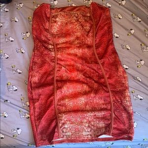 Red sleeveless snake design dress